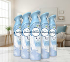 Multiple bottles of Febreze Air Mist Linen & Sky fragrance on a white background